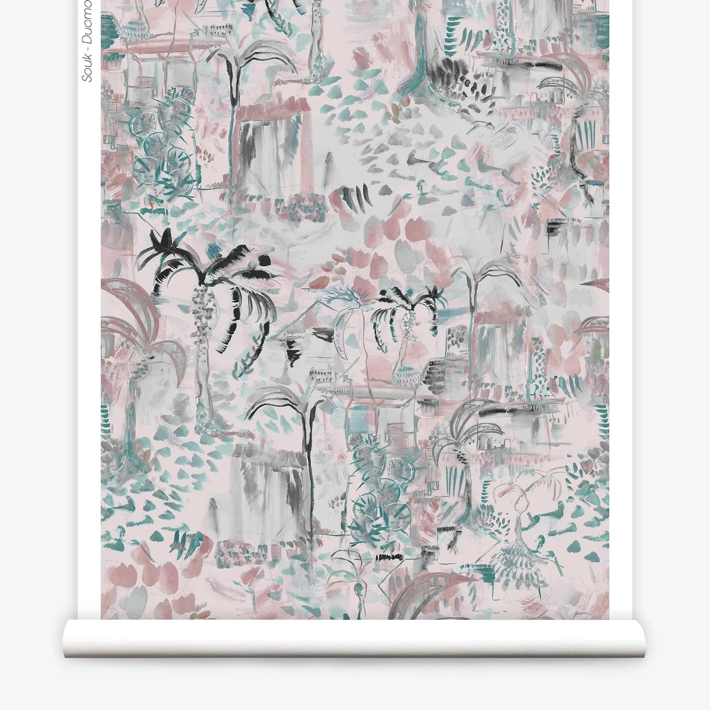 Partially unrolled wallpaper yardage in a painterly botanical print in shades of gray, pink and turquoise.