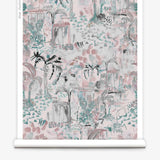 Partially unrolled wallpaper yardage in a painterly botanical print in shades of gray, pink and turquoise.