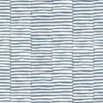 Detail of wallpaper in a broken stripe print in navy on a white field.