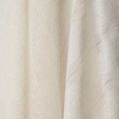 Two woven fabrics draped in a row in shades of cream.
