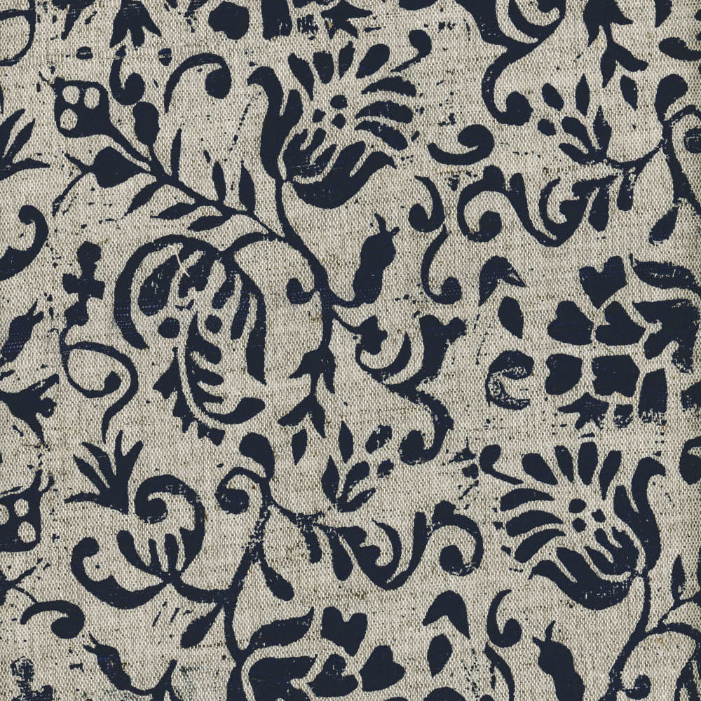 Close-up of fabric in a botanical print in black on a tan field.