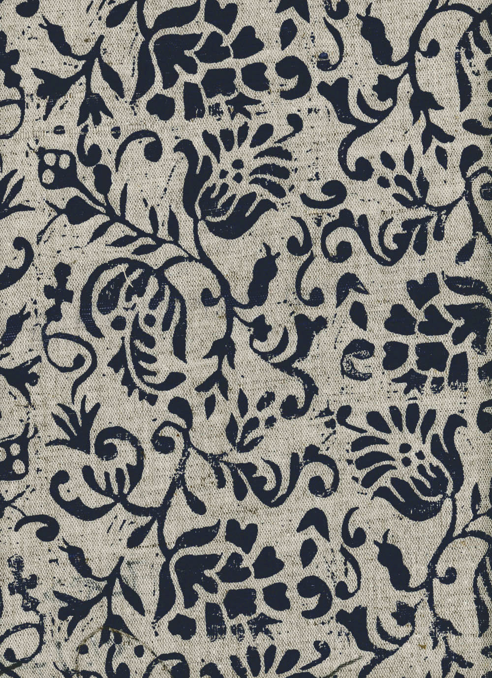 Close-up of fabric in a botanical print in black on a tan field.