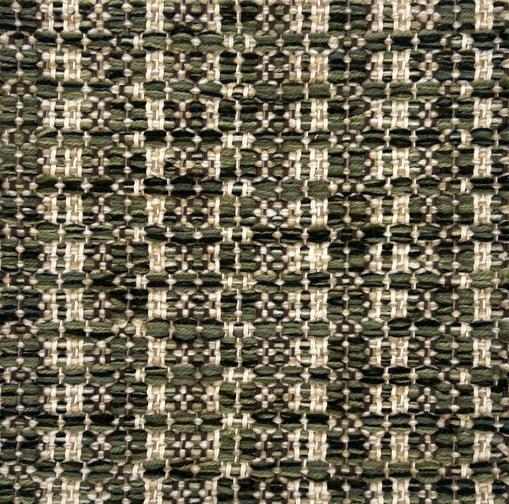 Textural flatweave rug in a striped check in green and tan.