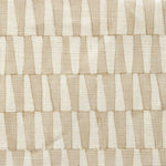 Close-up of fabric in a playful triangular stripe print in white and light brown.