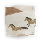 Fabric swatch with horse designs on a beige background