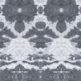 Detail of wallpaper in a painterly ikat print in shades of gray and light blue.