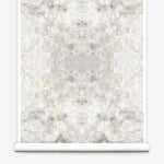 Partially unrolled wallpaper yardage in an abstract textural print in shades of cream, gray and tan.