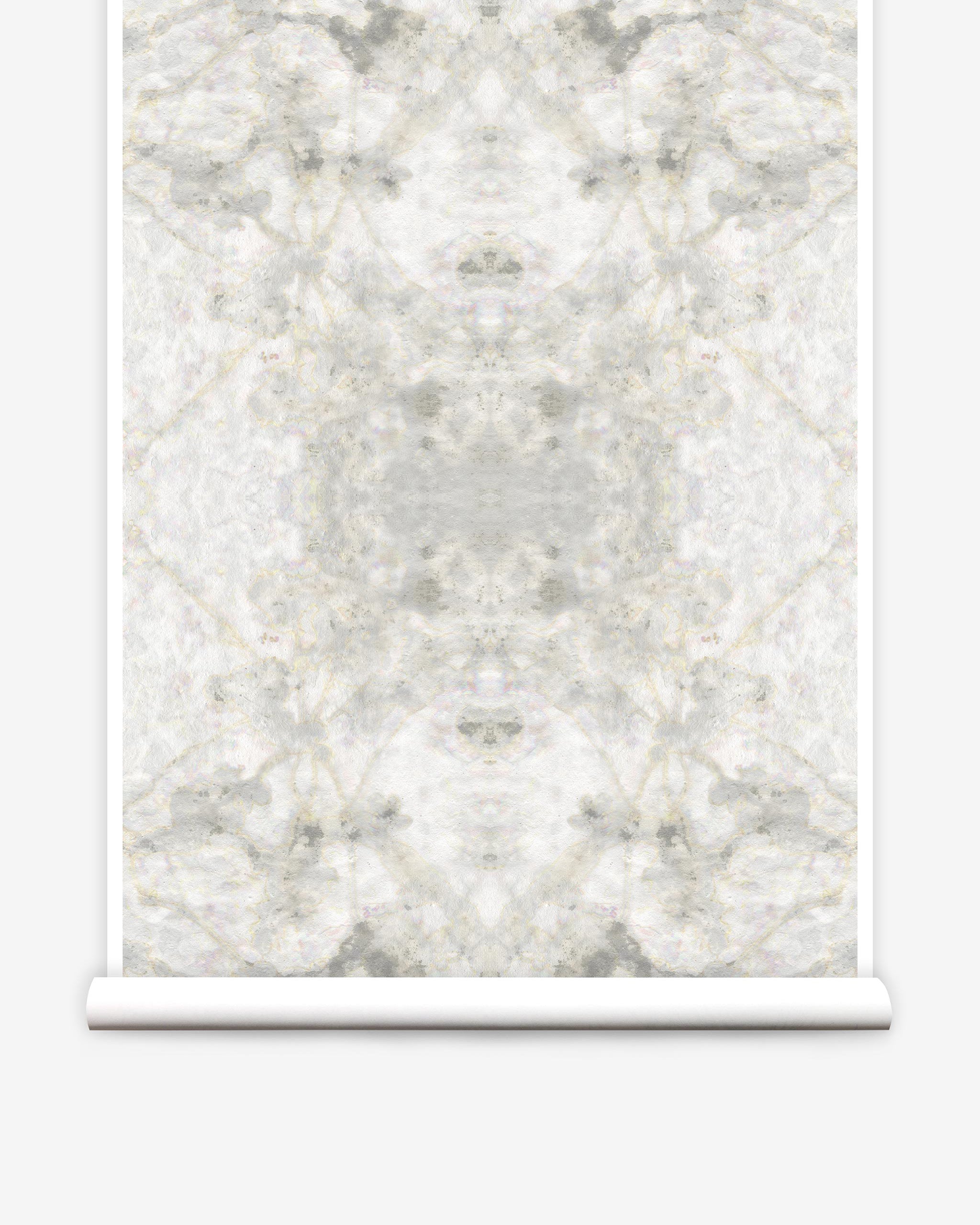 Partially unrolled wallpaper yardage in an abstract textural print in shades of cream, gray and tan.