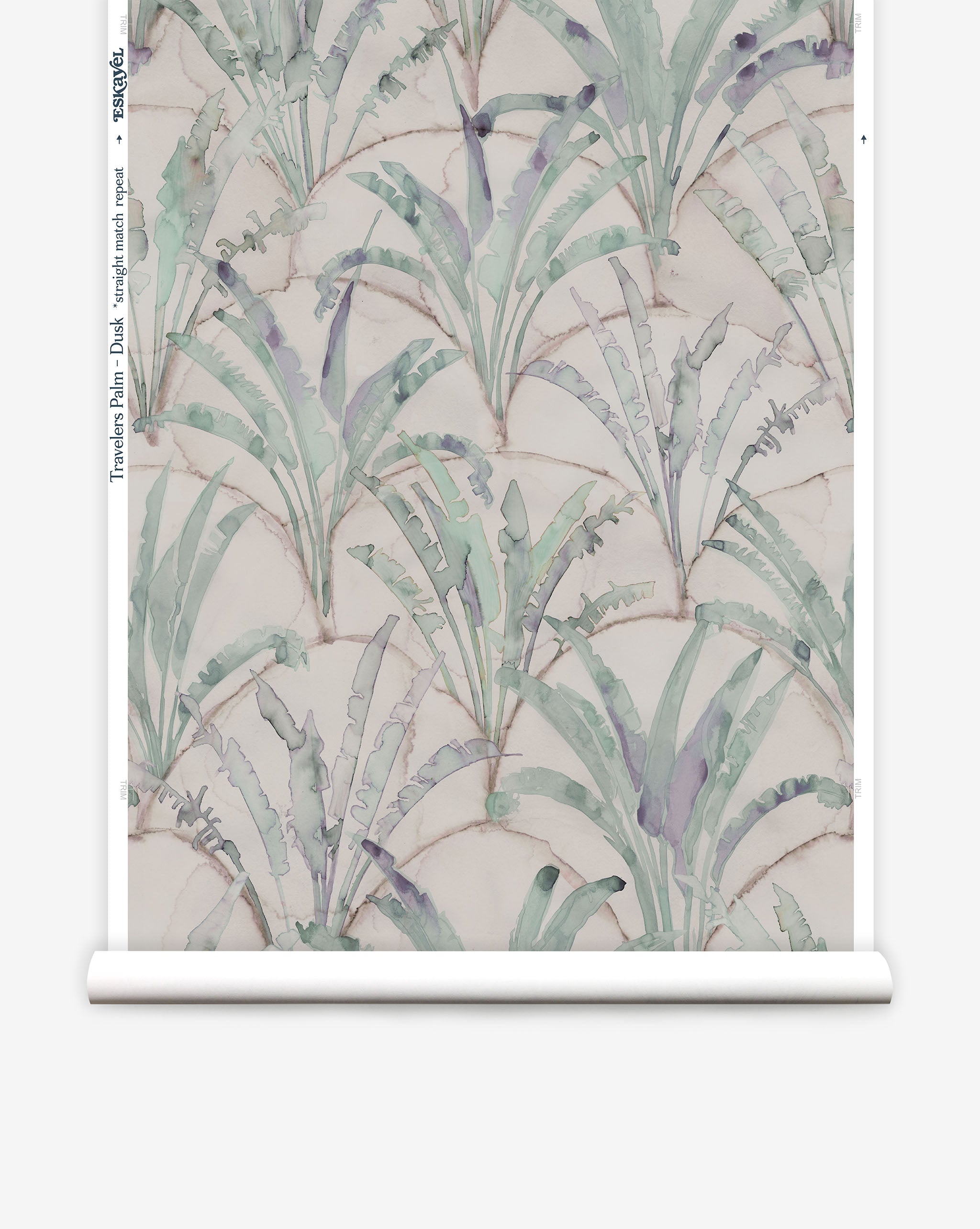 Partially unrolled wallpaper yardage in a painterly palm tree pattern in shades of green and purple on a tan field.