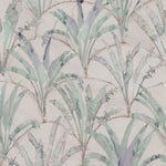 Detail of wallpaper in a painterly palm tree pattern in shades of green and purple on a tan field.