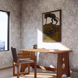 A modernist study with a large window and walls papered in a painterly palm tree pattern in pink, blue and cream.