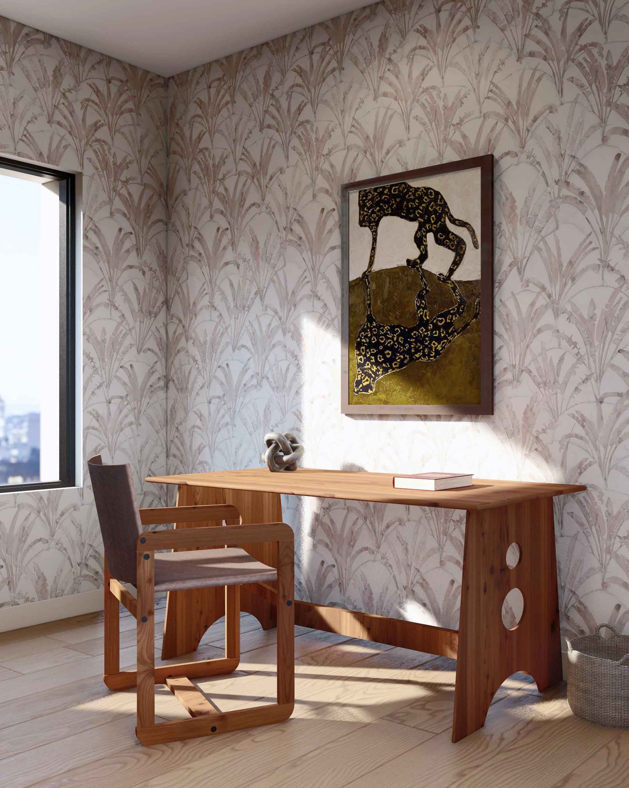 A modernist study with a large window and walls papered in a painterly palm tree pattern in pink, blue and cream.