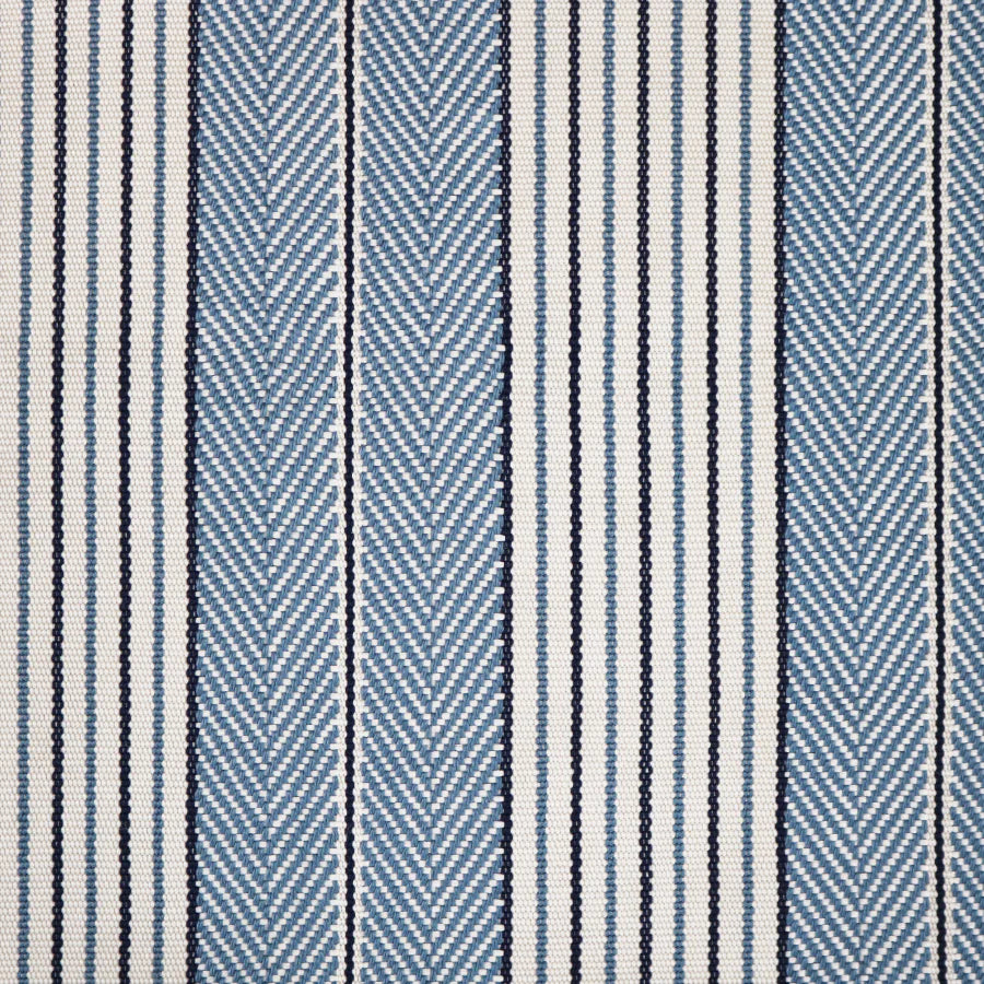 Broadloom carpet swatch in a herringbone striped pattern in a blue design