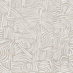 Detail of wallpaper in an abstract linear print in white on a cream field.