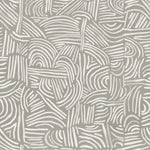 Detail of fabric in an abstract linear print in white on a sage field.