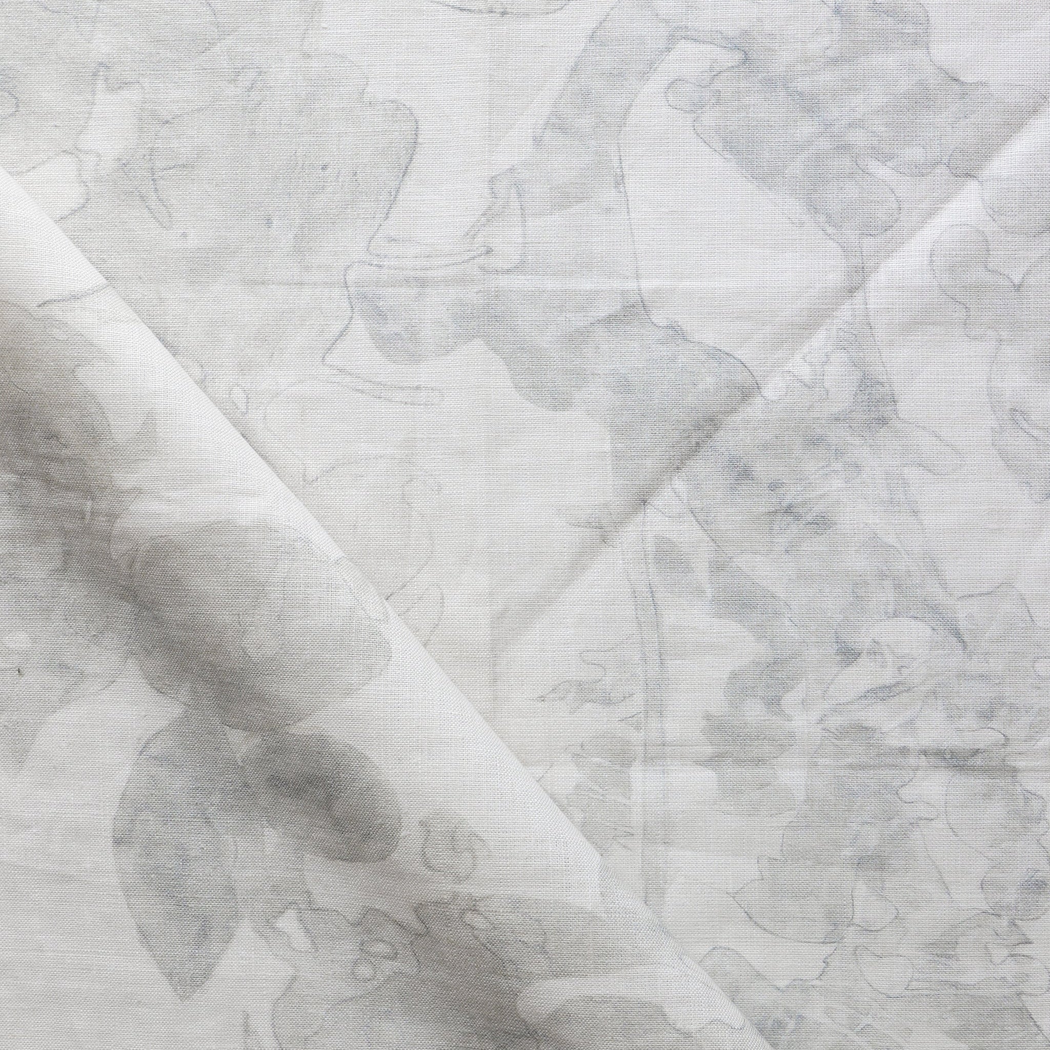 Draped fabric yardage in an abstract botanical print in shades of gray on a cream field.