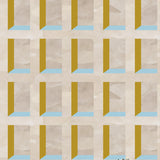 A potted cactus stands in front of a wall papered in a dimensional grid print in shades of cream, light blue and yellow.