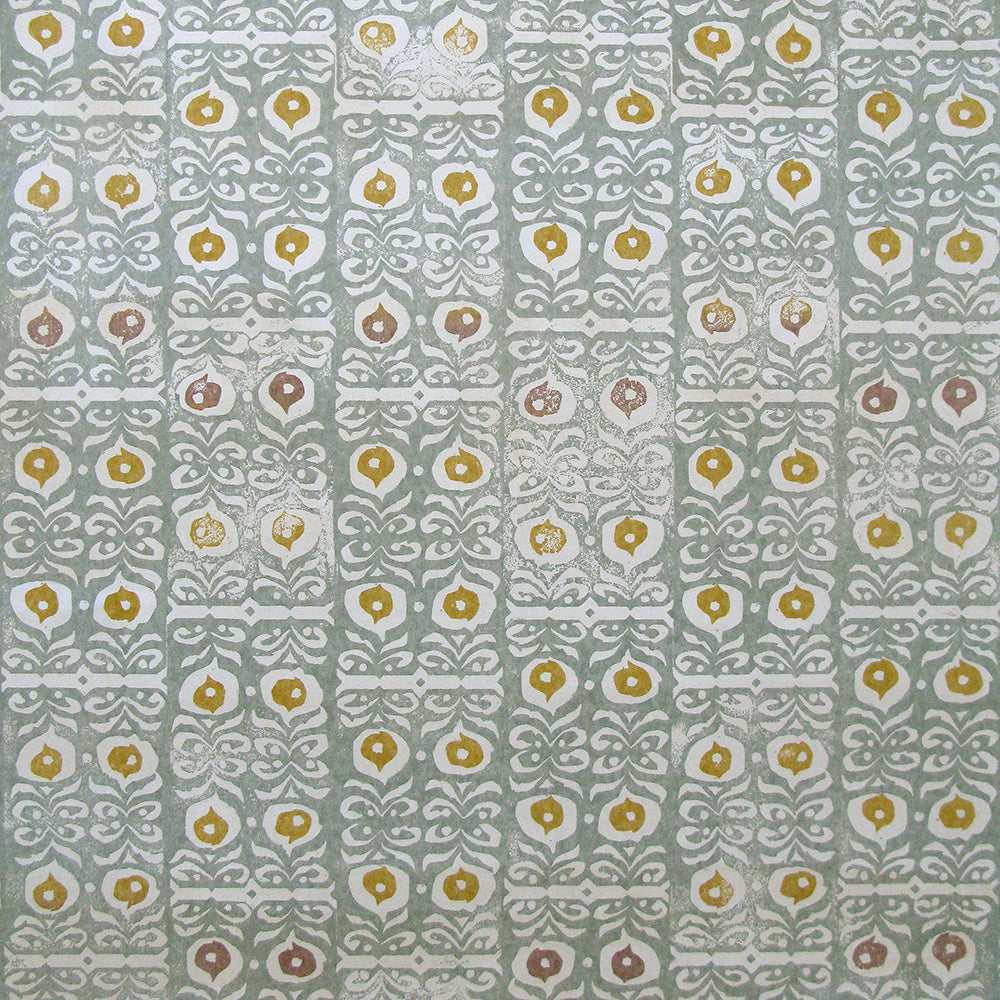 Wallpaper in a repeating damask print in mustard and white on a blue-gray field.