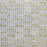 Wallpaper in a repeating damask print in mustard and white on a gray field.