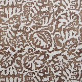 Wallpaper in a botanical paisley print in white on a brown field.