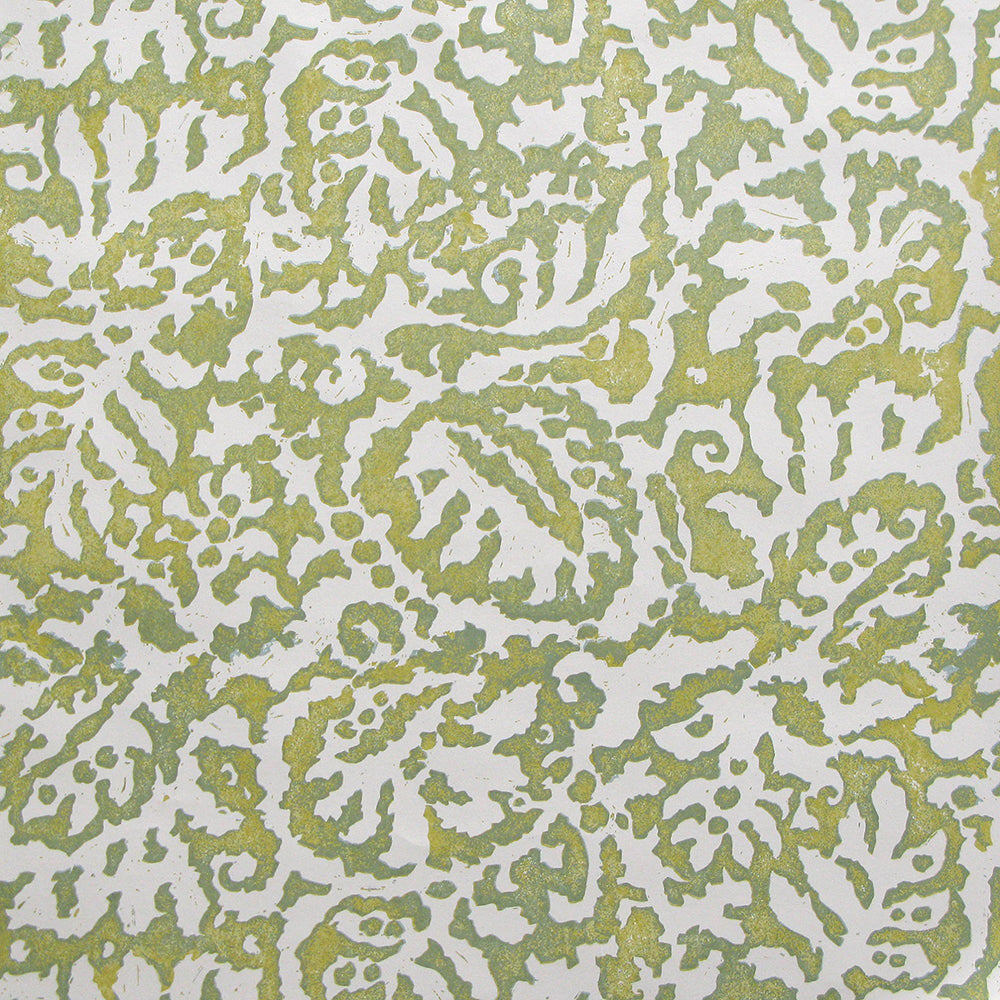 Wallpaper in a botanical paisley print in white on a light green field.