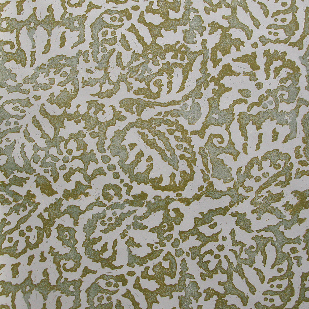 Wallpaper in a botanical paisley print in cream on a mottled tan field.