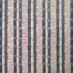 Detail of wallpaper in a dense tribal stripe pattern in shades of cream, navy and brown.