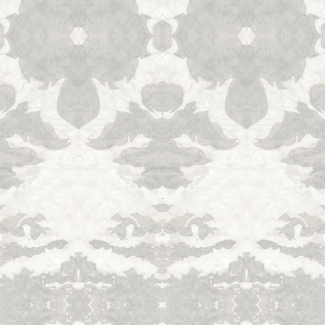 Detail of wallpaper in a painterly ikat print in shades of gray and cream.