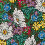 Detail of wallpaper in a large-scale floral print in a rainbow of colors on a brown field.