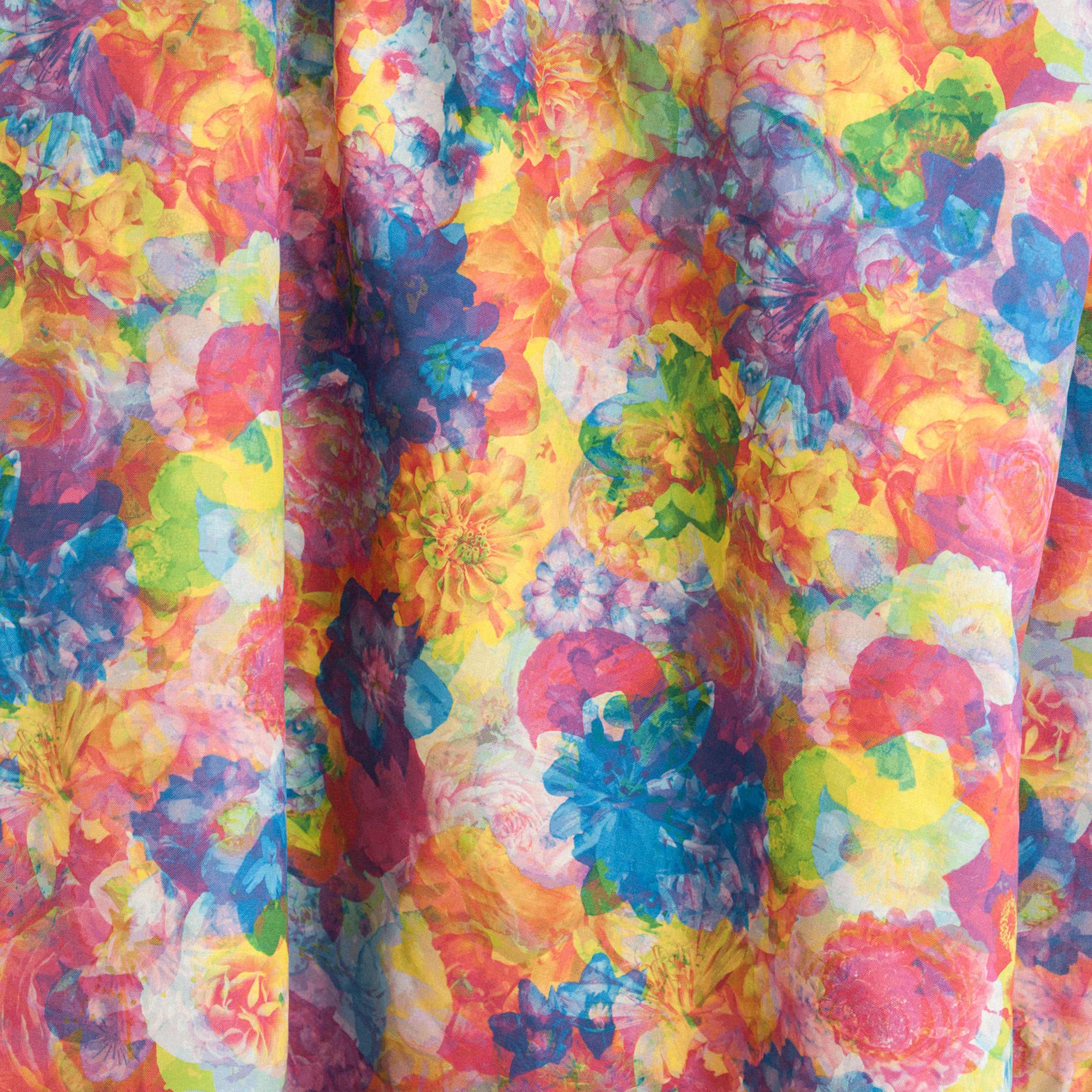 Draped fabric yardage in a dense photorealistic floral print in multicolor neon shades.