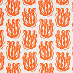 Woven fabric swatch with a repeating cartoon seaweed print in orange on a white background.