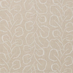 Woven fabric swatch with a large-scale repeating leaf print in white on a cream background.