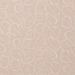 Woven fabric swatch with a large-scale repeating leaf print in white on a light pink background.