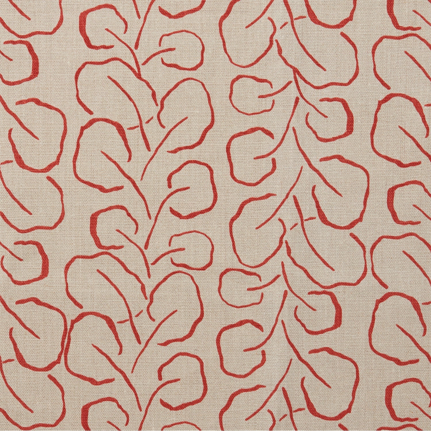 Woven fabric swatch with a large-scale repeating leaf print in red on a tan background.