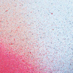 Close up of paint splatters in red and blue.