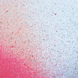 Close up of paint splatters in red and blue.