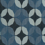 Detail of Alhambra Rug featuring a pattern of linked circles that create a star like lattice in a range of blue shades, from pale blue to chambray, indigo, to dark navy