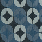 Detail of Alhambra Rug featuring a pattern of linked circles that create a star like lattice in a range of blue shades, from pale blue to chambray, indigo, to dark navy