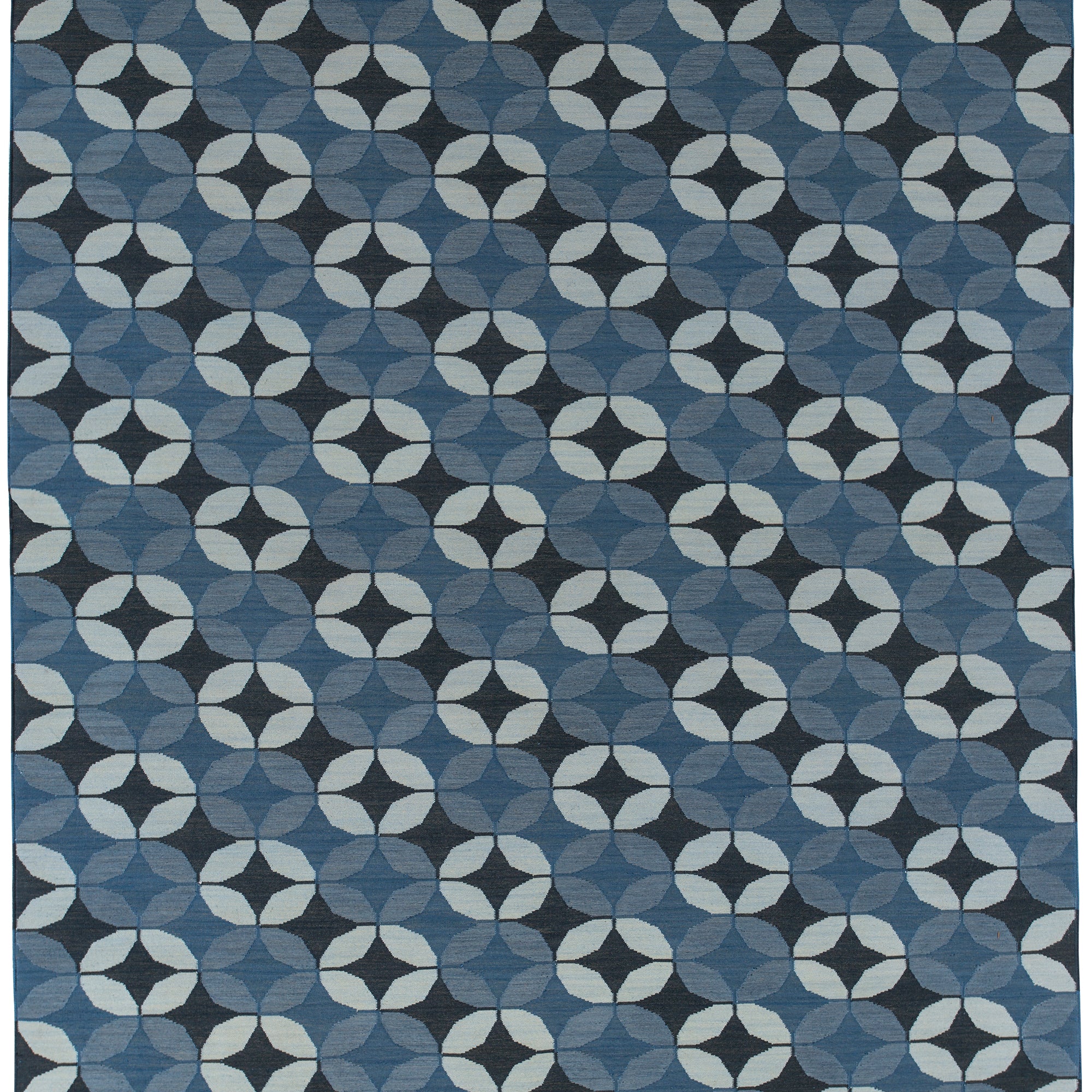 Full size Alhambra Rug featuring a pattern of linked circles that create a star like lattice in a range of blue shades, from pale blue to chambray, indigo, to dark navy
