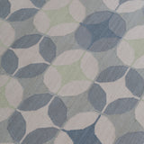 Detail of Alhambra Rug in Seafret featuring pattern of linked circles that create a star like lattice in a range of pale blues, with a light green accent on a soft white field. 