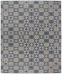 Full size Alhambra Rug in Seafret featuring pattern of linked circles that create a star like lattice in a range of pale blues, with a light green accent on a soft white field. 