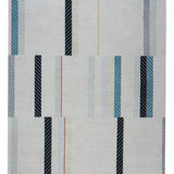 Full size Amelia Rug in Camara featuring a minimalist broken stripe pattern, overlayed with thin white diagonal lines. The broken stripes are a mix of black, pale blue and turquoise with accents of red and bright yellow, all on a soft grey field