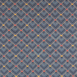 The Arrow Rug in Indigo-Coral features a dense pattern of nesting arrow shapes in shades of blue with accents of coral and yellow on a light brown field