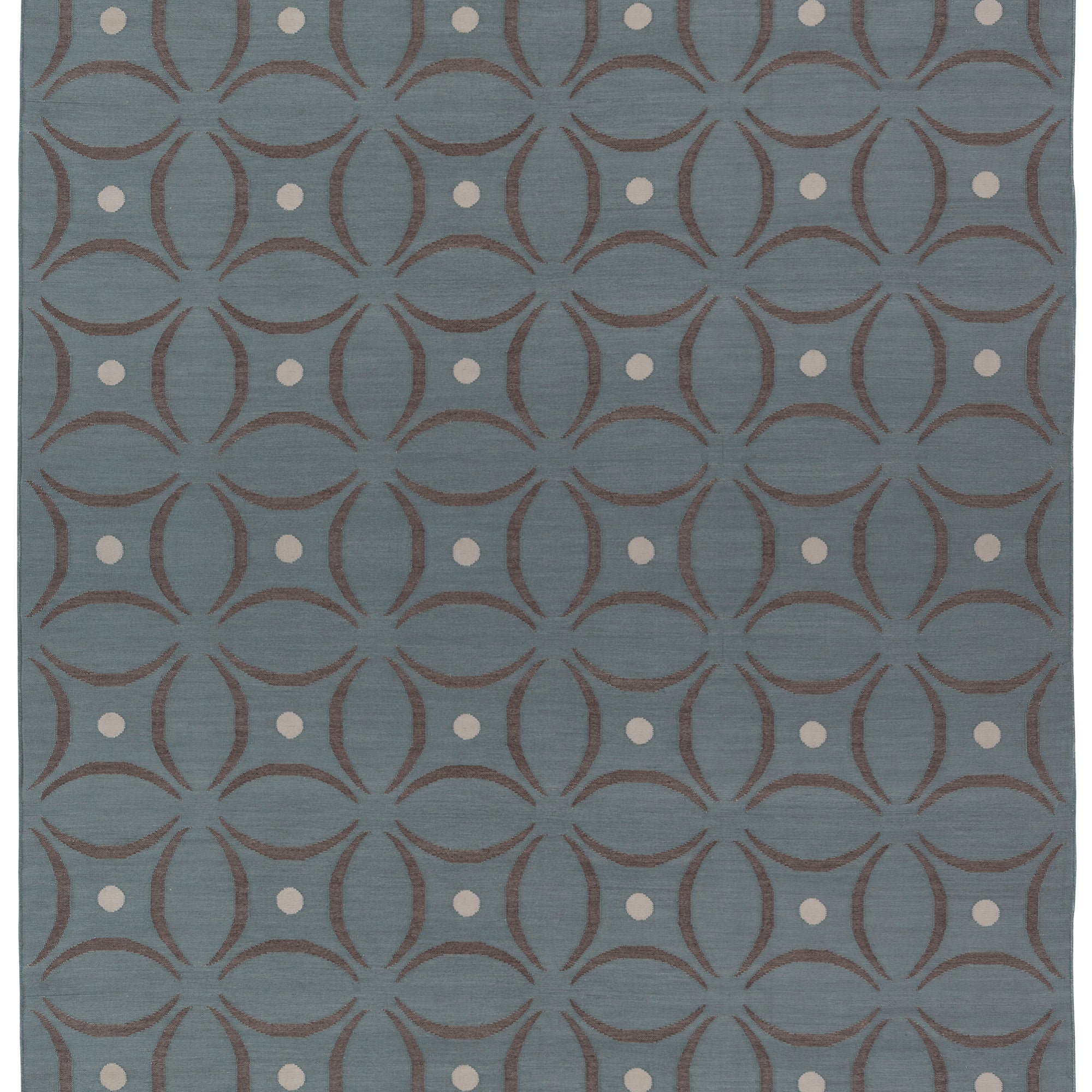 Full size Boe rug in Argento, featuring a pattern of curved segments in grey with white circles on a blue field. 