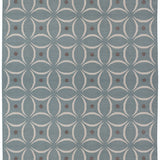 Full size Boe rug in Argento, featuring a pattern of white curved segments with taupe circles on a blue field. 