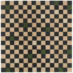 Checkerboard Rug in King, a black and tan checkered pattern with random accents of green and white. 