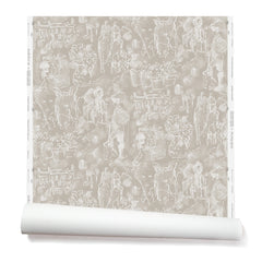Partially unrolled wallpaper with a pattern of repeating watercolor illustrations of horses, farmers and country houses in white on a tan background.