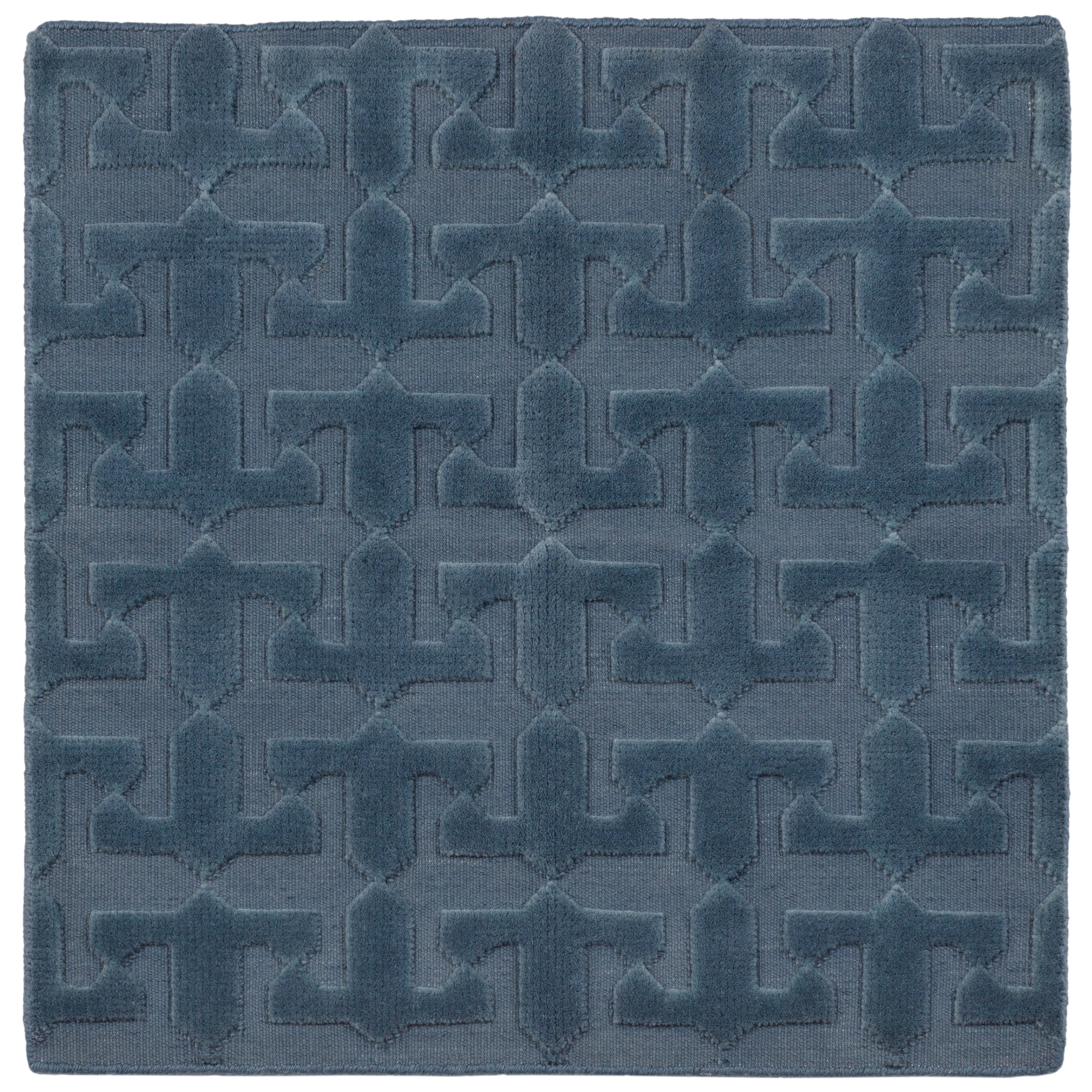 Detail of the Rug in Stormy Sky, a textural monochromatic abstract geometric pattern in blue. 