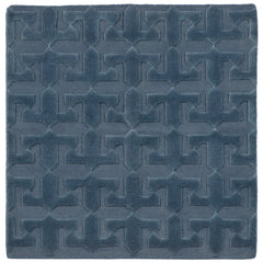 Detail of the Rug in Stormy Sky, a textural monochromatic abstract geometric pattern in blue. 