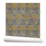 Wallpaper roll with a stamped painted floral motif in yellow and brown on a grey background.